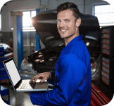 Mobile locksmith technician programming a car key