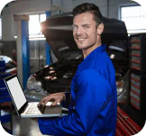 Mobile locksmith technician programming a car key